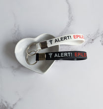 Load image into Gallery viewer, Black or White Epilepsy awareness keyring
